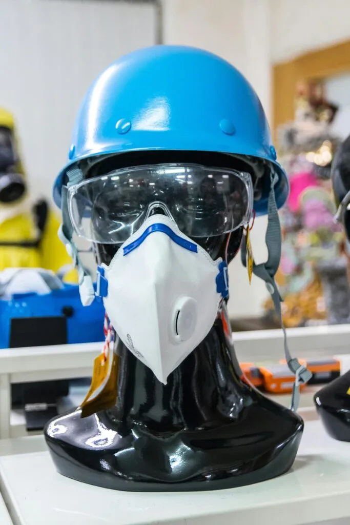 pexels-photo-3846183-3846183 Mannequin showcasing blue helmet, goggles, and mask for safety and protection.